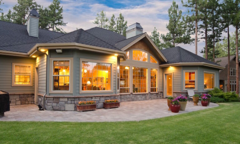 custom backyard stone tile patio trees and shrubs 768x462